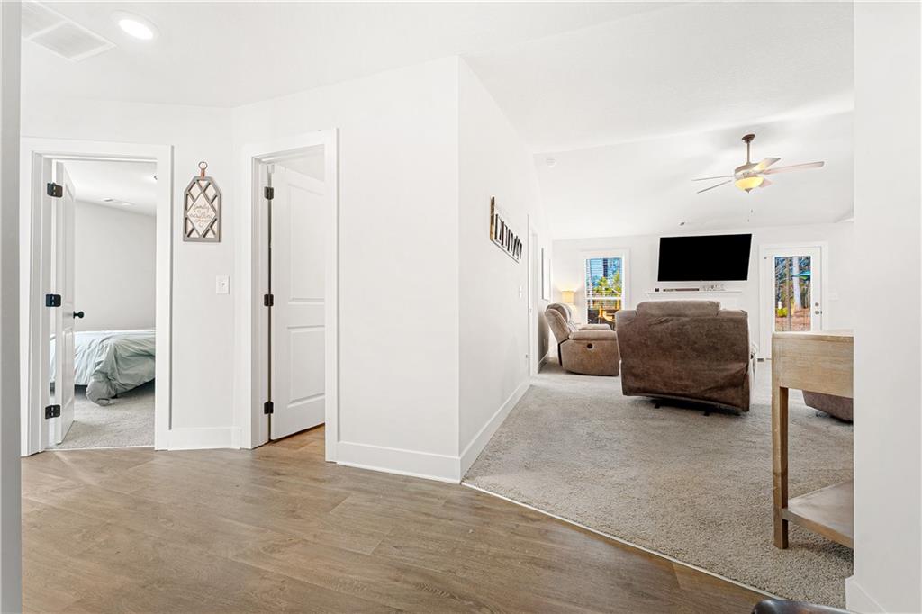 328 Walnut Drive Hartwell, GA 30643 - Photo 4 of 33 a bedroom with furniture and a flat screen tv