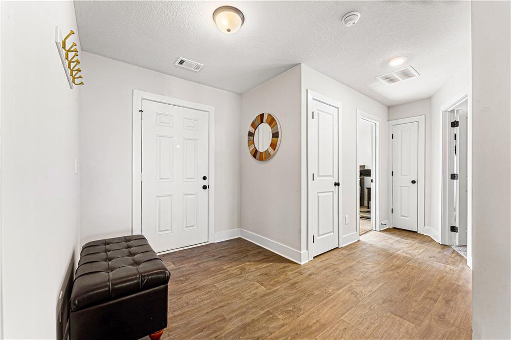 328 Walnut Drive Hartwell, GA 30643 - Photo 5 of 33 a view of a livingroom with entryway wooden floor and window