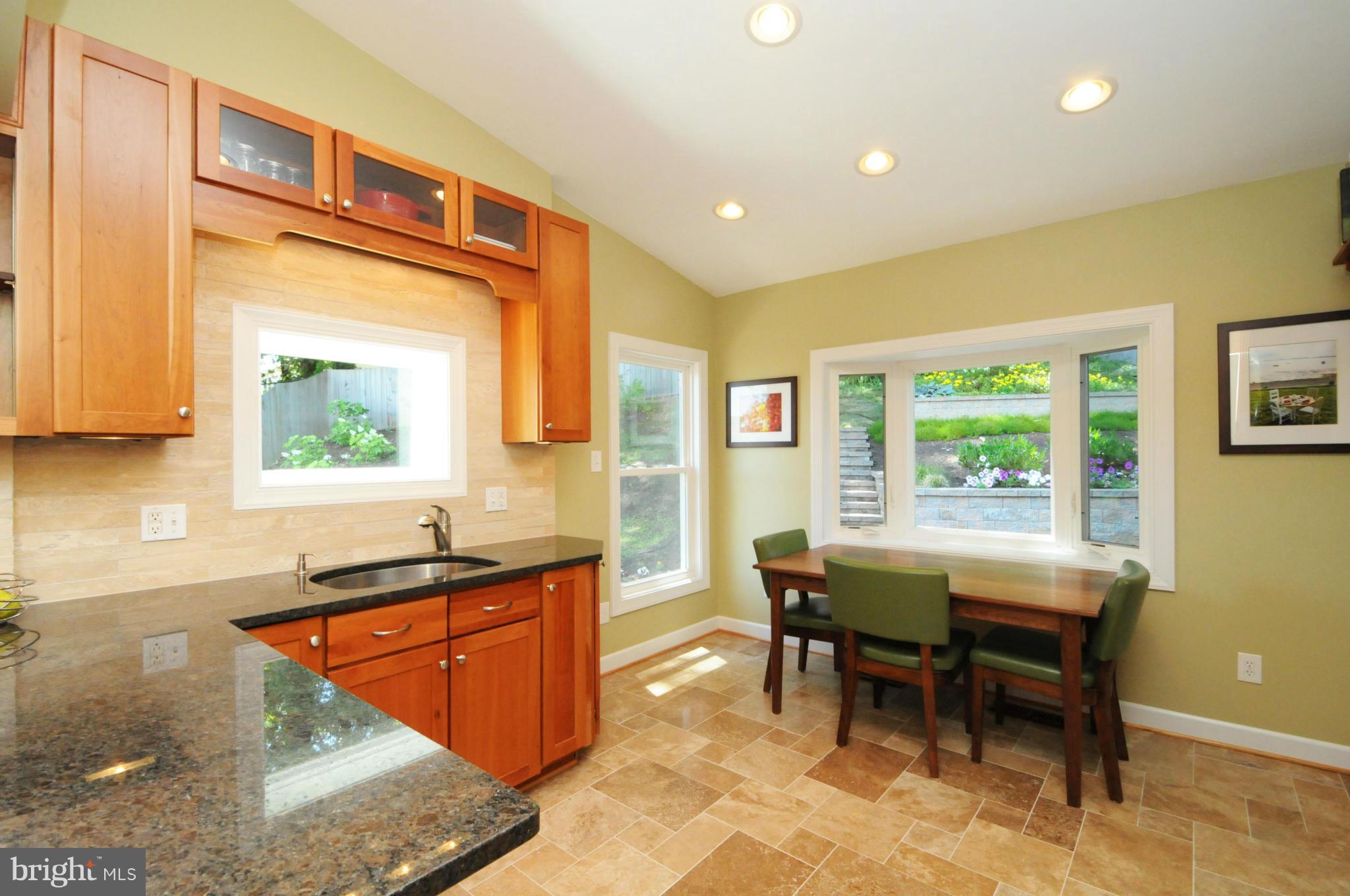 6313 Beryl Road Alexandria, VA 22312 - Photo 18 of 30 a kitchen with a sink and wooden cabinets