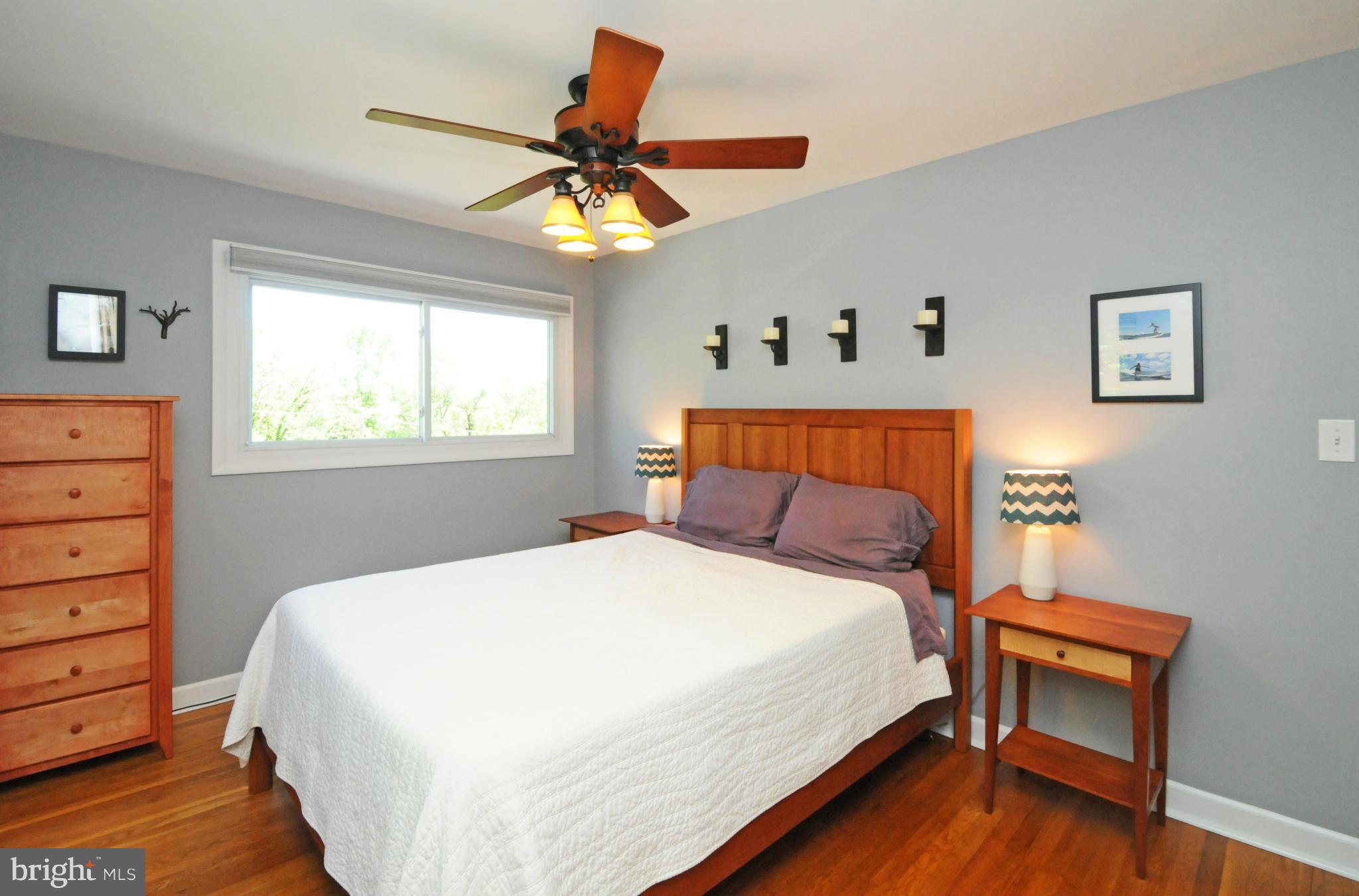 6313 Beryl Road Alexandria, VA 22312 - Photo 19 of 30 a bedroom with a bed and a chandelier