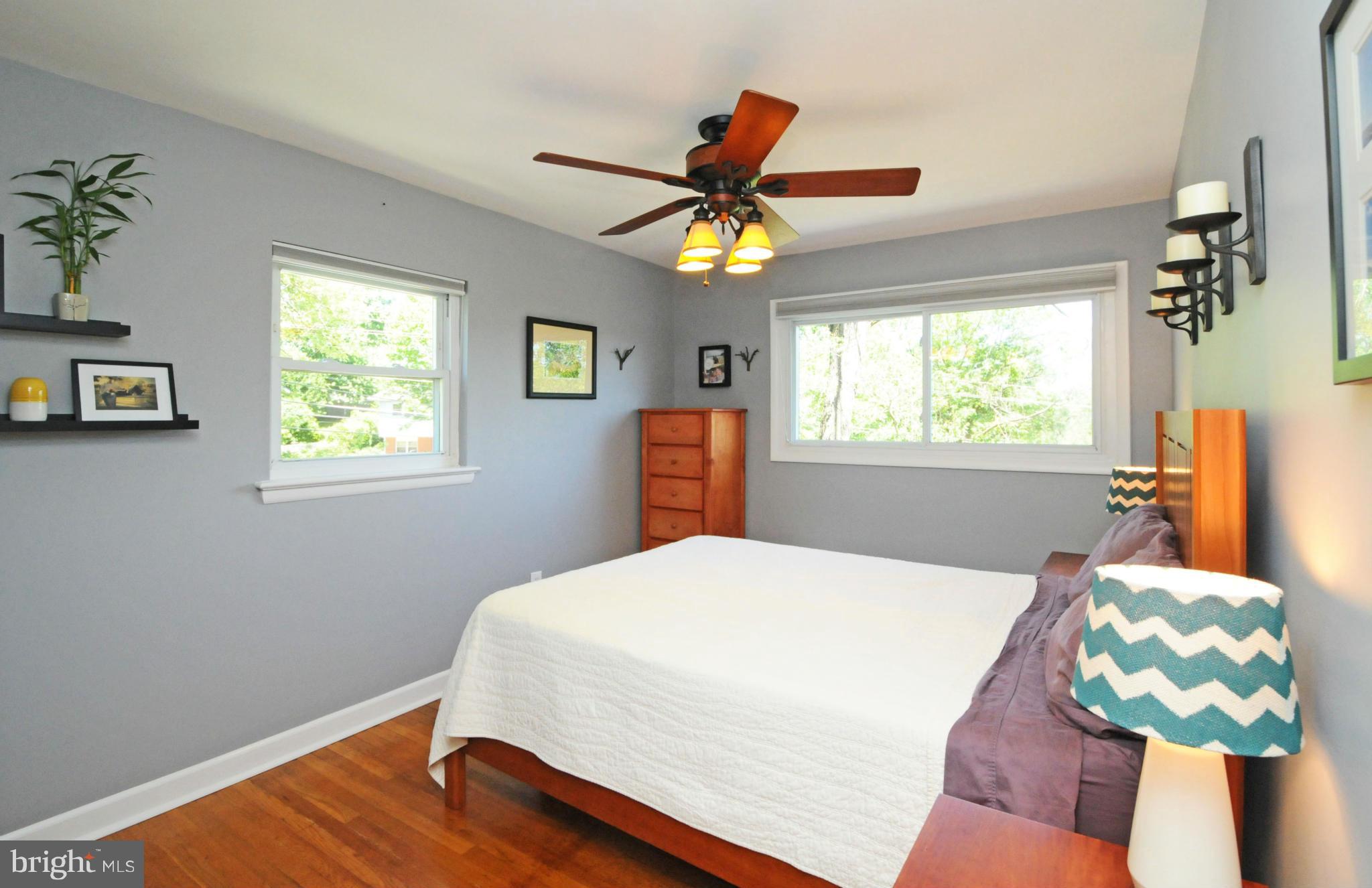 6313 Beryl Road Alexandria, VA 22312 - Photo 20 of 30 a bedroom with wooden floor and window