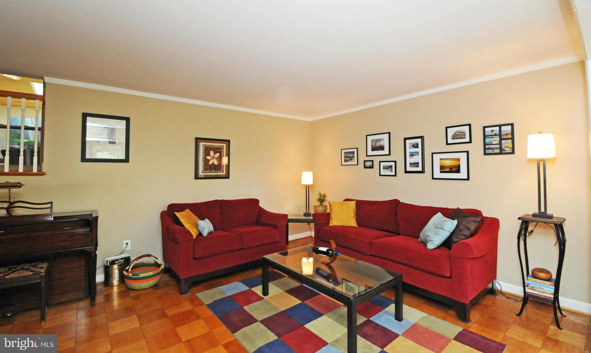 6313 Beryl Road Alexandria, VA 22312 - Photo 3 of 30 a living room with furniture and a couch