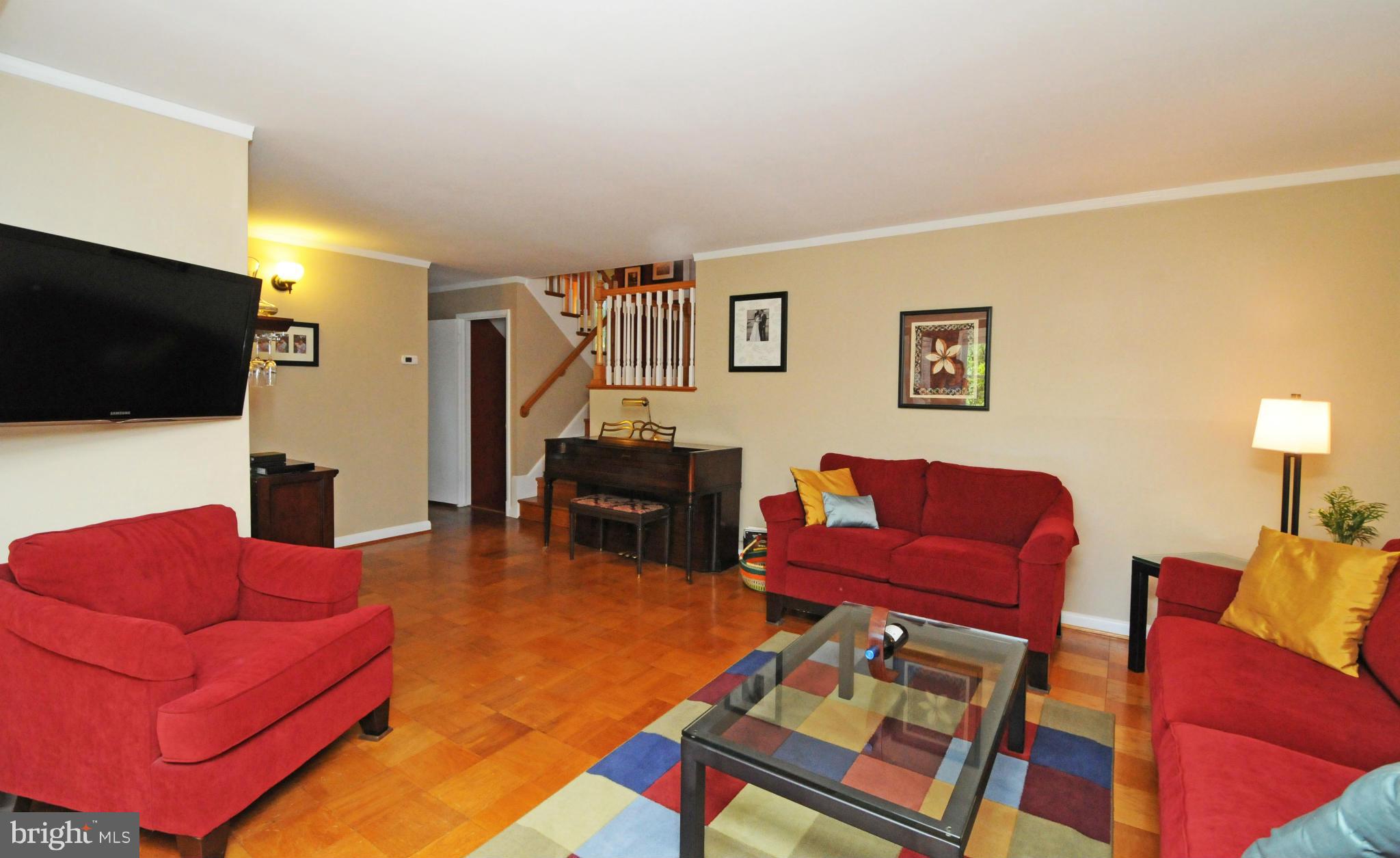 6313 Beryl Road Alexandria, VA 22312 - Photo 4 of 30 a living room with furniture and a flat screen tv