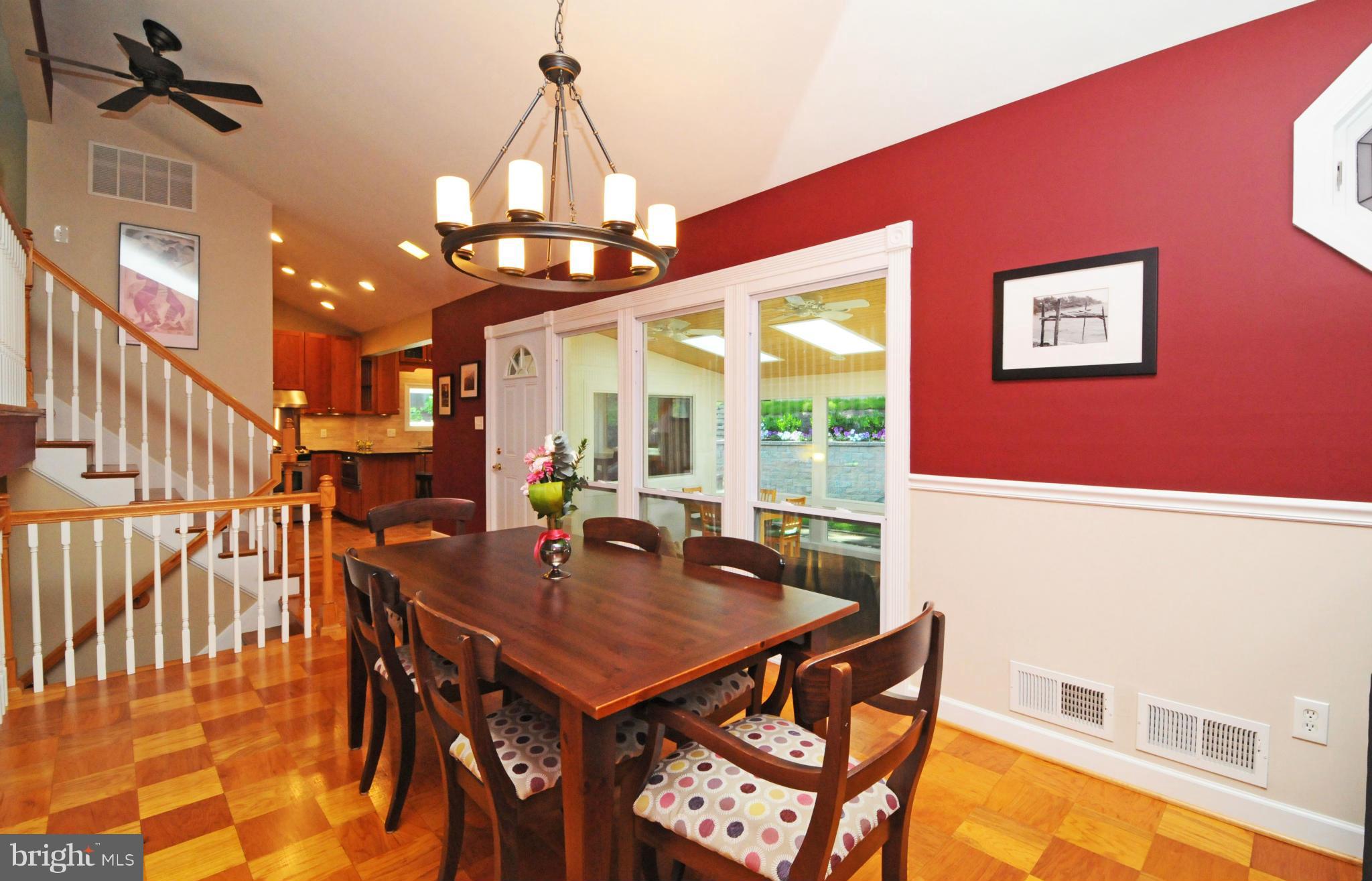 6313 Beryl Road Alexandria, VA 22312 - Photo 9 of 30 a view of a dining room with furniture and a chandelier