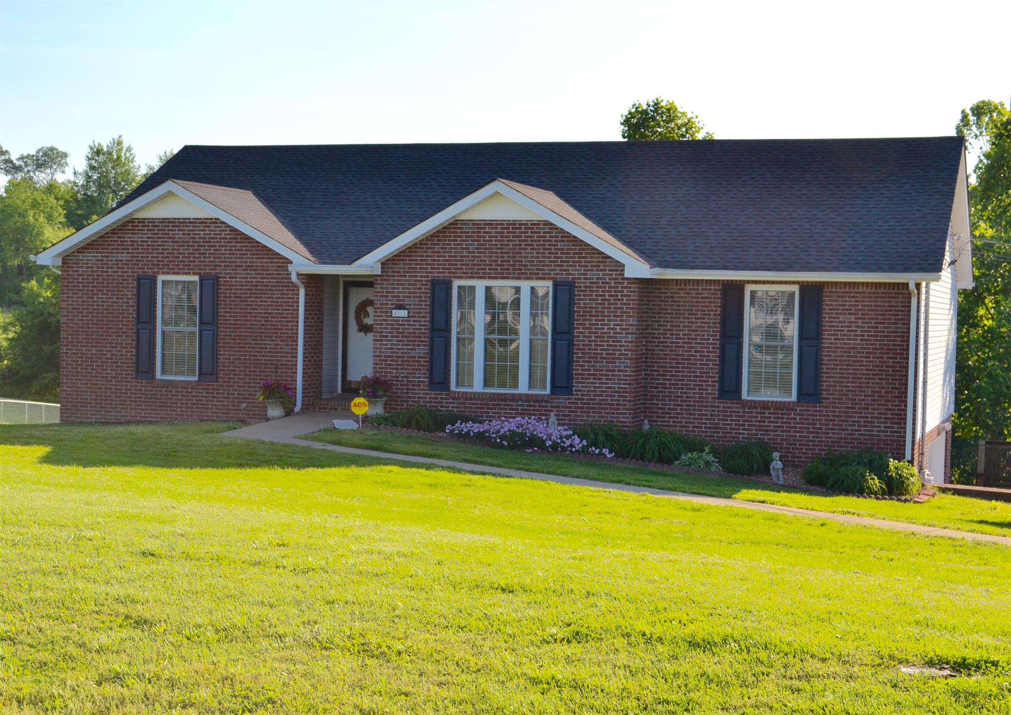 a view of a house with swimming pool