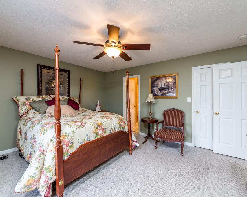 4212 Station Road Cunningham, TN 37052 - Photo 15 of 29 a bed room with a bed and a chair
