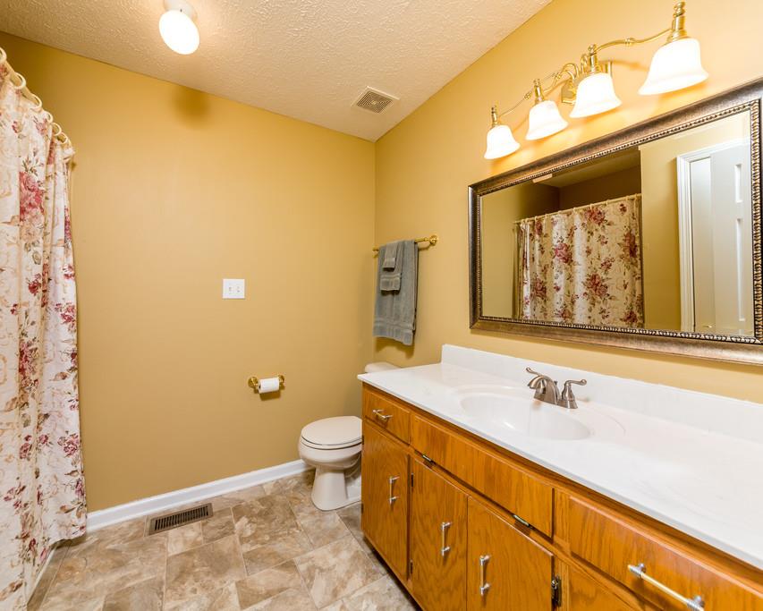 4212 Station Road Cunningham, TN 37052 - Photo 16 of 29 a bathroom with a sink and a mirror