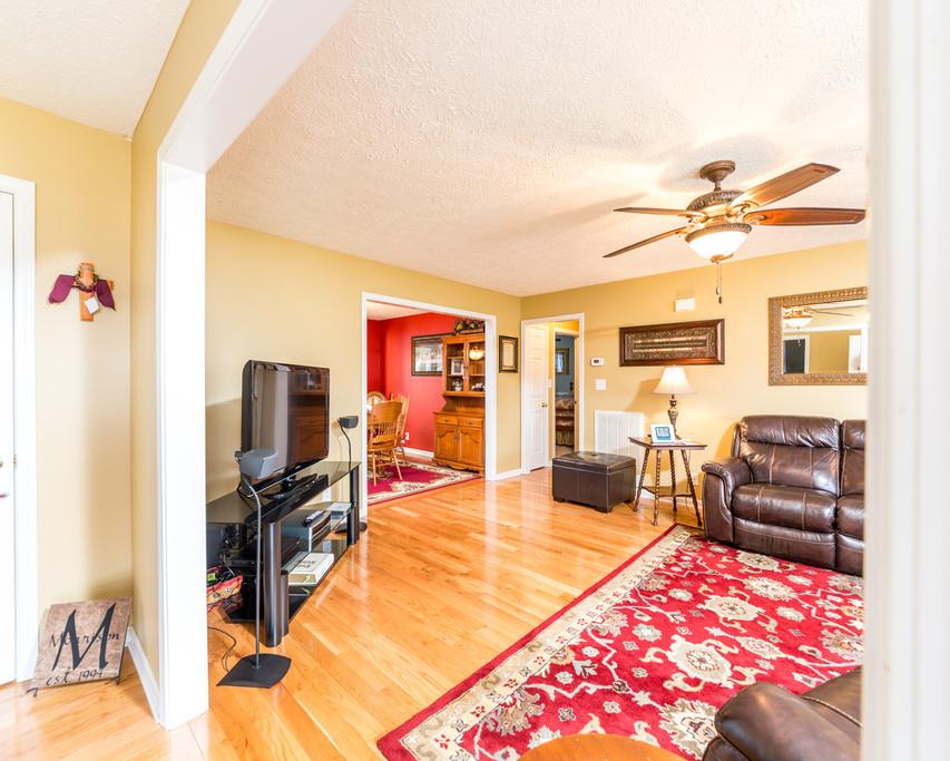 4212 Station Road Cunningham, TN 37052 - Photo 3 of 29 a living room with furniture a flat screen tv and a table