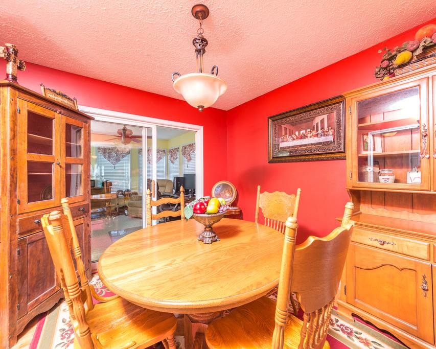 4212 Station Road Cunningham, TN 37052 - Photo 7 of 29 a view of a dining room with furniture a chandelier and a large window