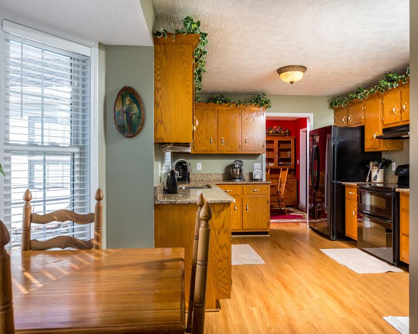 4212 Station Road Cunningham, TN 37052 - Photo 10 of 29 a view of a kitchen with refrigerator and a stove top oven