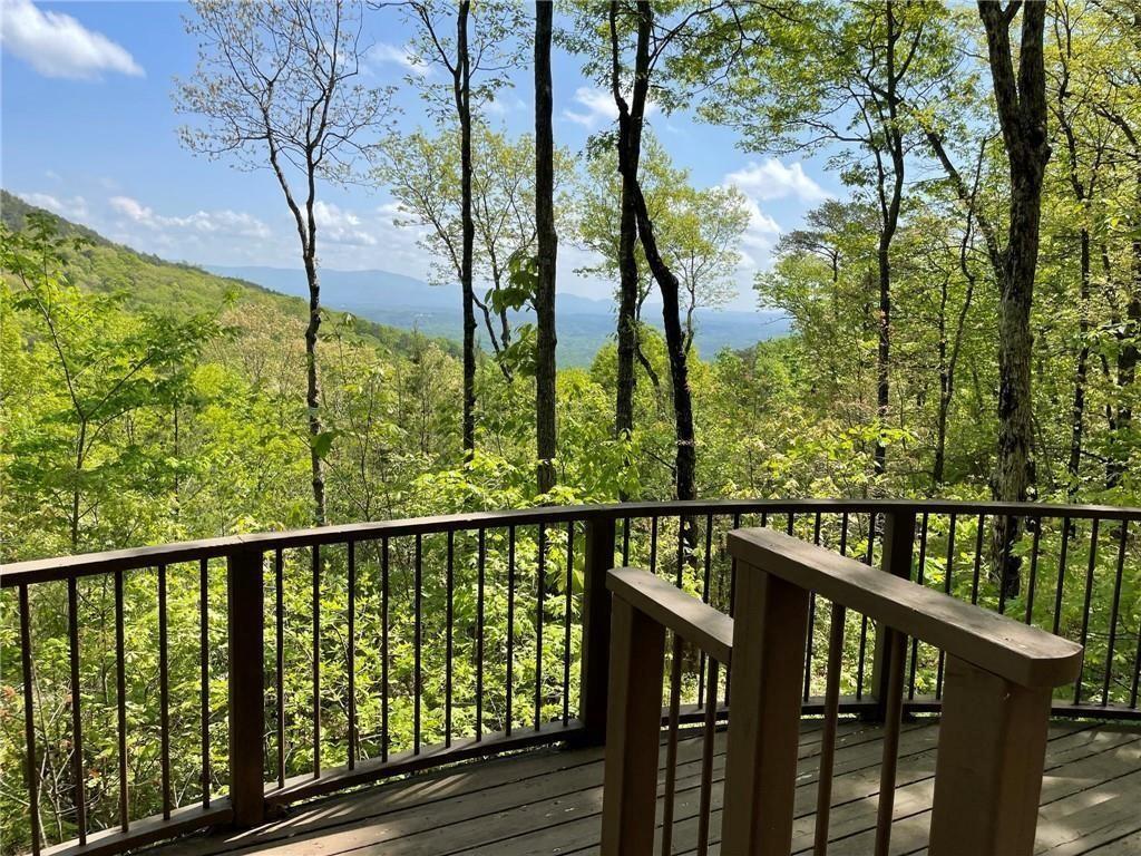 249 Owl Ridge Way Jasper, GA 30143 - Photo 14 of 14 a view of a balcony with wooden fence