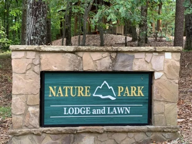 a view of outdoor space with signage and flags