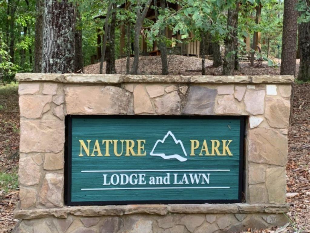 249 Owl Ridge Way Jasper, GA 30143 - Photo 3 of 14 a view of outdoor space with signage and flags