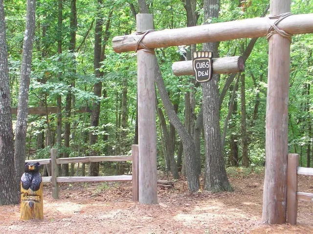 a view of a wooden fence next to a yard