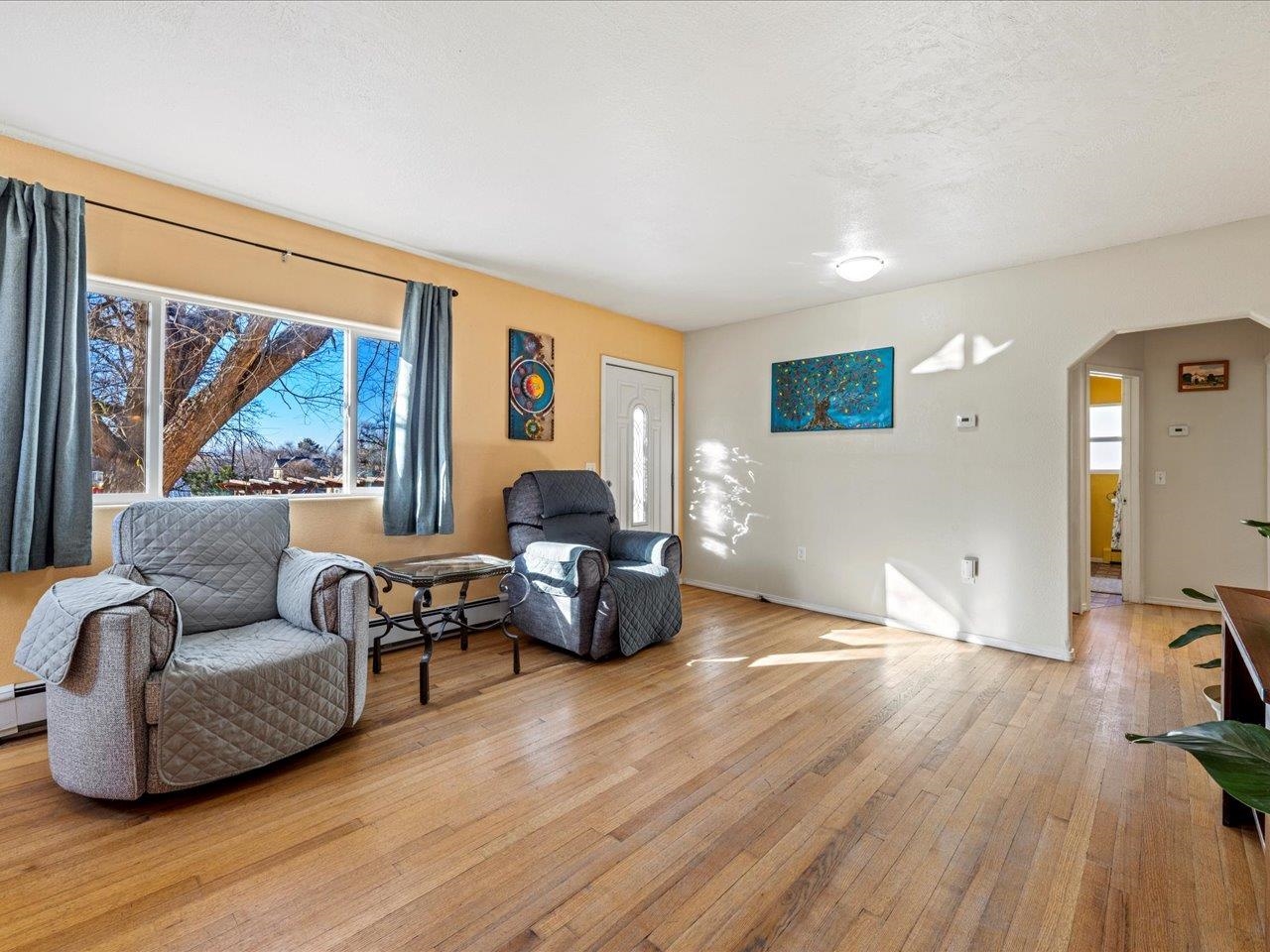 608 Bluff Street Delta, CO 81416 - Photo 12 of 42 a living room with furniture and a flat screen tv