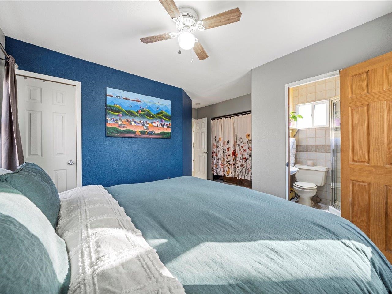 608 Bluff Street Delta, CO 81416 - Photo 24 of 42 a bedroom with a large bed and a window