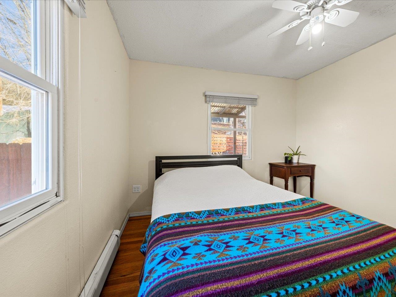 608 Bluff Street Delta, CO 81416 - Photo 28 of 42 a bed sitting in a bedroom next to a window