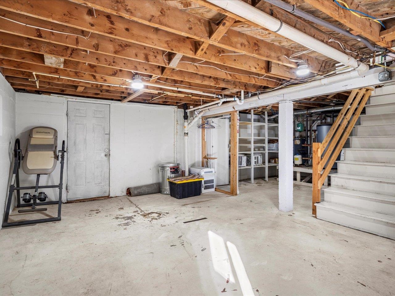 608 Bluff Street Delta, CO 81416 - Photo 33 of 42 a view of an empty room with wooden floor