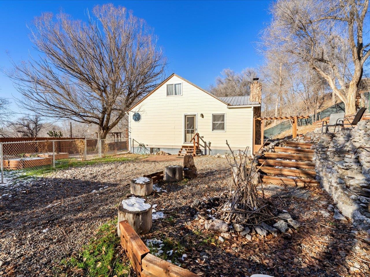 608 Bluff Street Delta, CO 81416 - Photo 38 of 42 a view of a backyard with plants and large trees