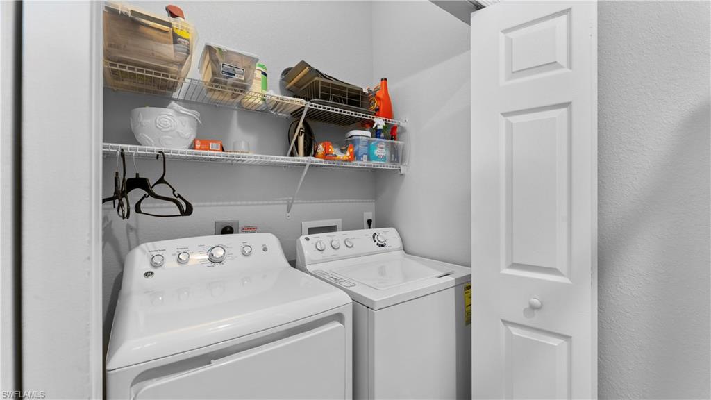 9727 Acqua Court, Unit 444 Naples, FL 34113 - Photo 20 of 25 a utility room with dryer and washer