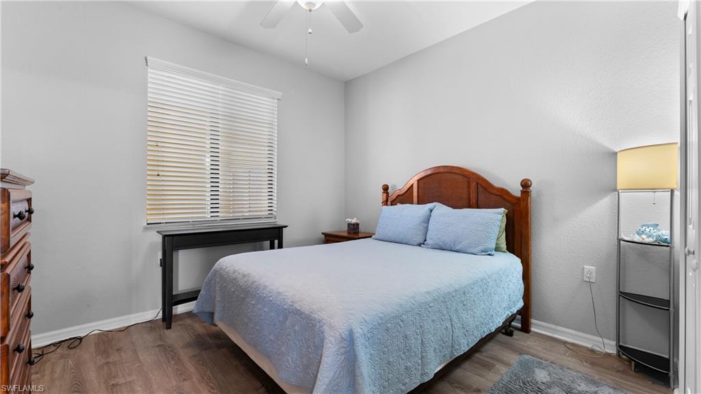9727 Acqua Court, Unit 444 Naples, FL 34113 - Photo 6 of 25 a bedroom with a bed a window and dresser