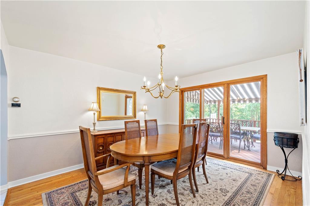 102 Conewanta Road Pittsburgh, PA 15241 - Photo 11 of 25 a dining room with furniture a chandelier and wooden floor