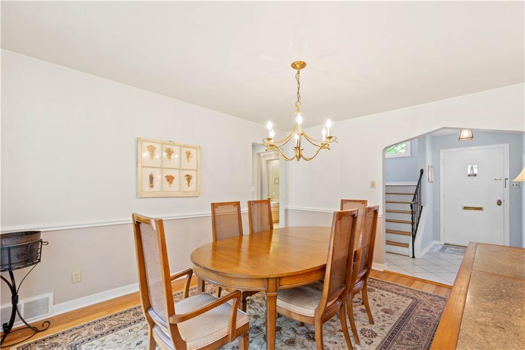 102 Conewanta Road Pittsburgh, PA 15241 - Photo 12 of 25 a view of a dining room with furniture and wooden floor