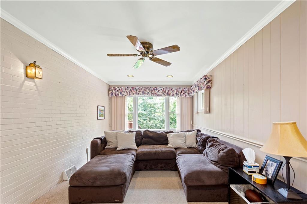 102 Conewanta Road Pittsburgh, PA 15241 - Photo 13 of 25 a living room with furniture and a large window