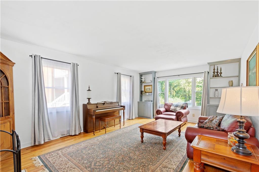 102 Conewanta Road Pittsburgh, PA 15241 - Photo 7 of 25 a living room with furniture rug and a window