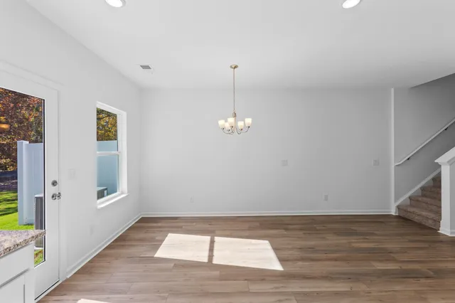 a view of kitchen with sink microwave and cabinets