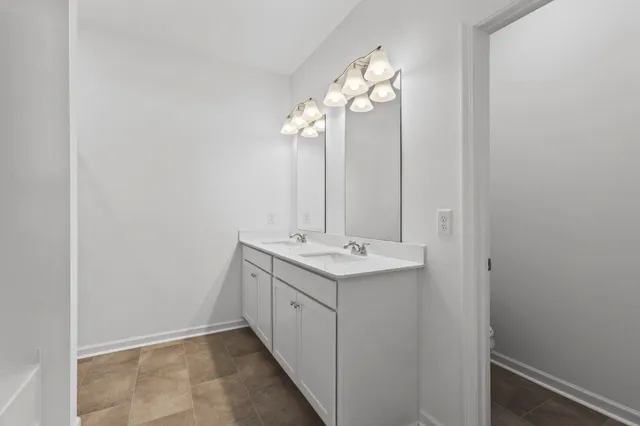 a white bath tub sitting next to a shower