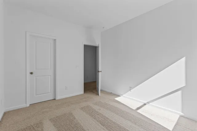 a bathroom with a sink a toilet a mirror a bathtub and shower