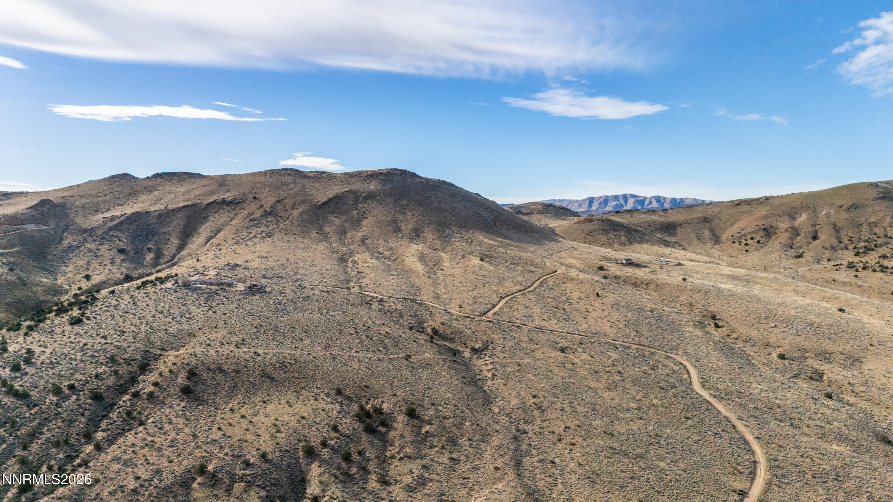 0 Ironwood Road Reno, NV 89510 - Photo 22 of 40 a view of a dry yard with mountains in the background