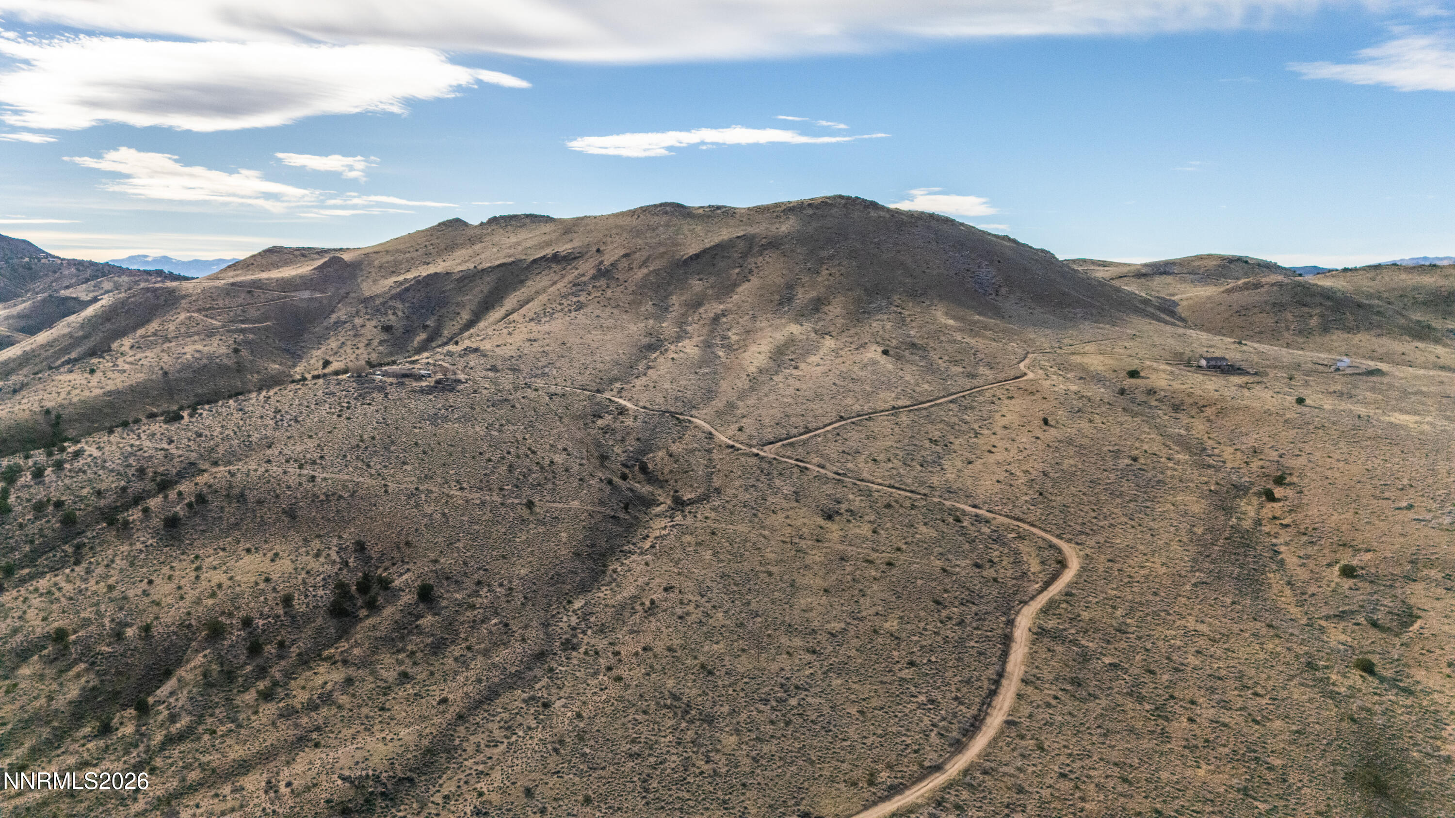 0 Ironwood Road Reno, NV 89510 - Photo 24 of 40 a view of a dry yard with mountains in the background