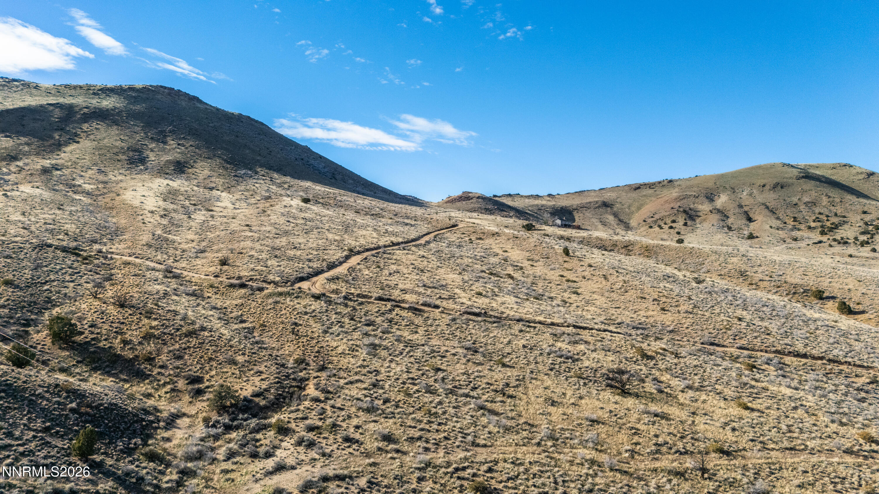 0 Ironwood Road Reno, NV 89510 - Photo 34 of 40 a view of a dry yard with mountains in the background