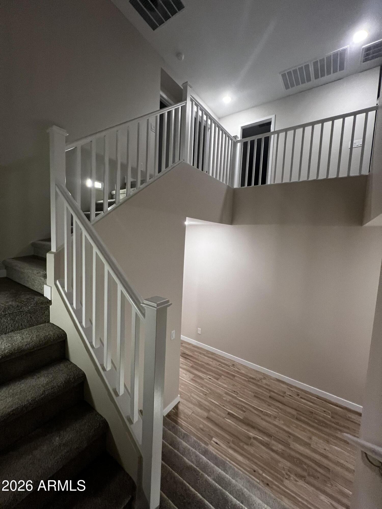 3375 South 181st Lane Goodyear, AZ 85338 - Photo 2 of 4 a view of staircase with railing and a window