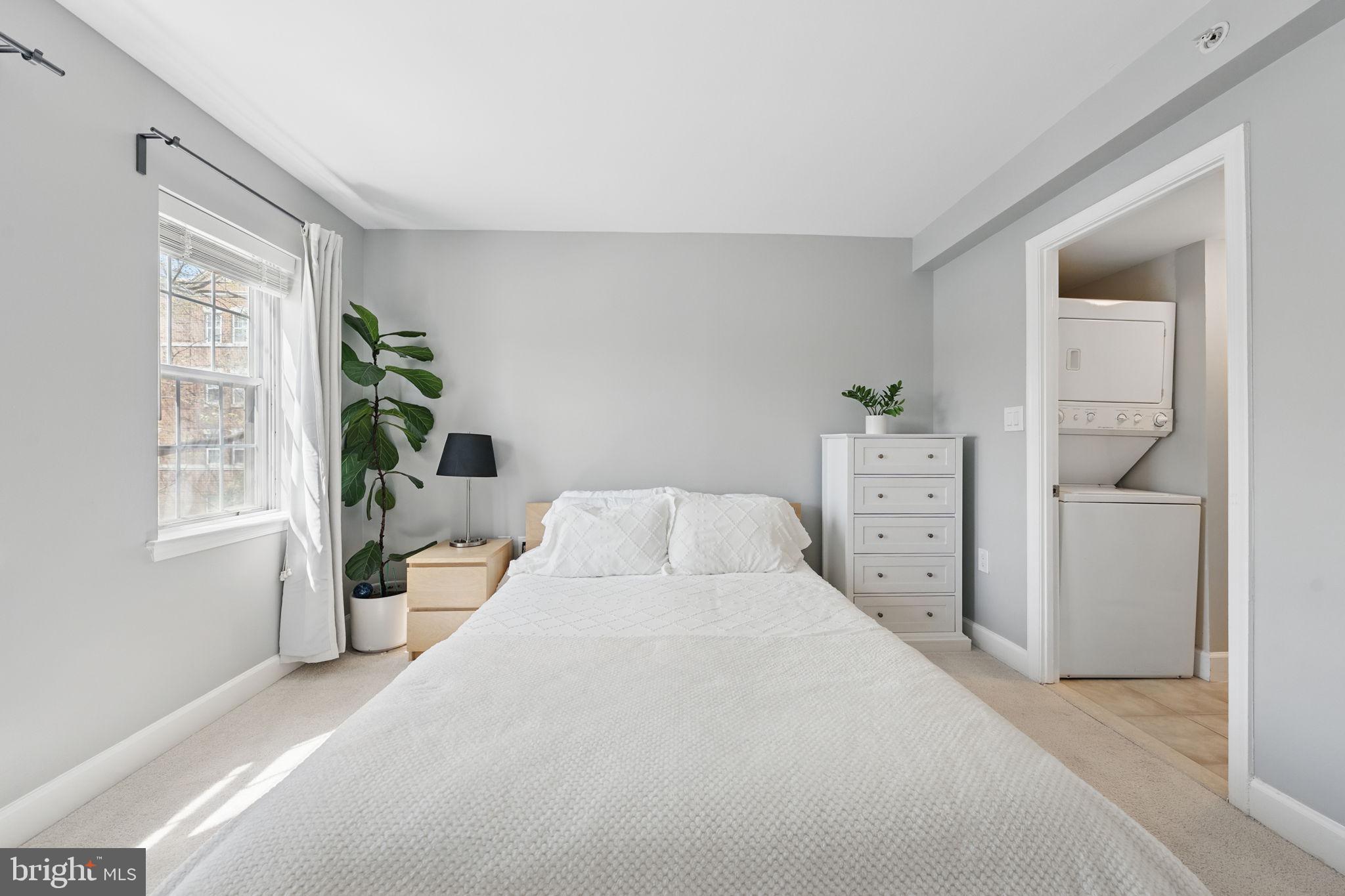 3611 38th Street Northwest, Unit 209 Washington, DC 20016 - Photo 11 of 30 a bedroom with a bed and a window