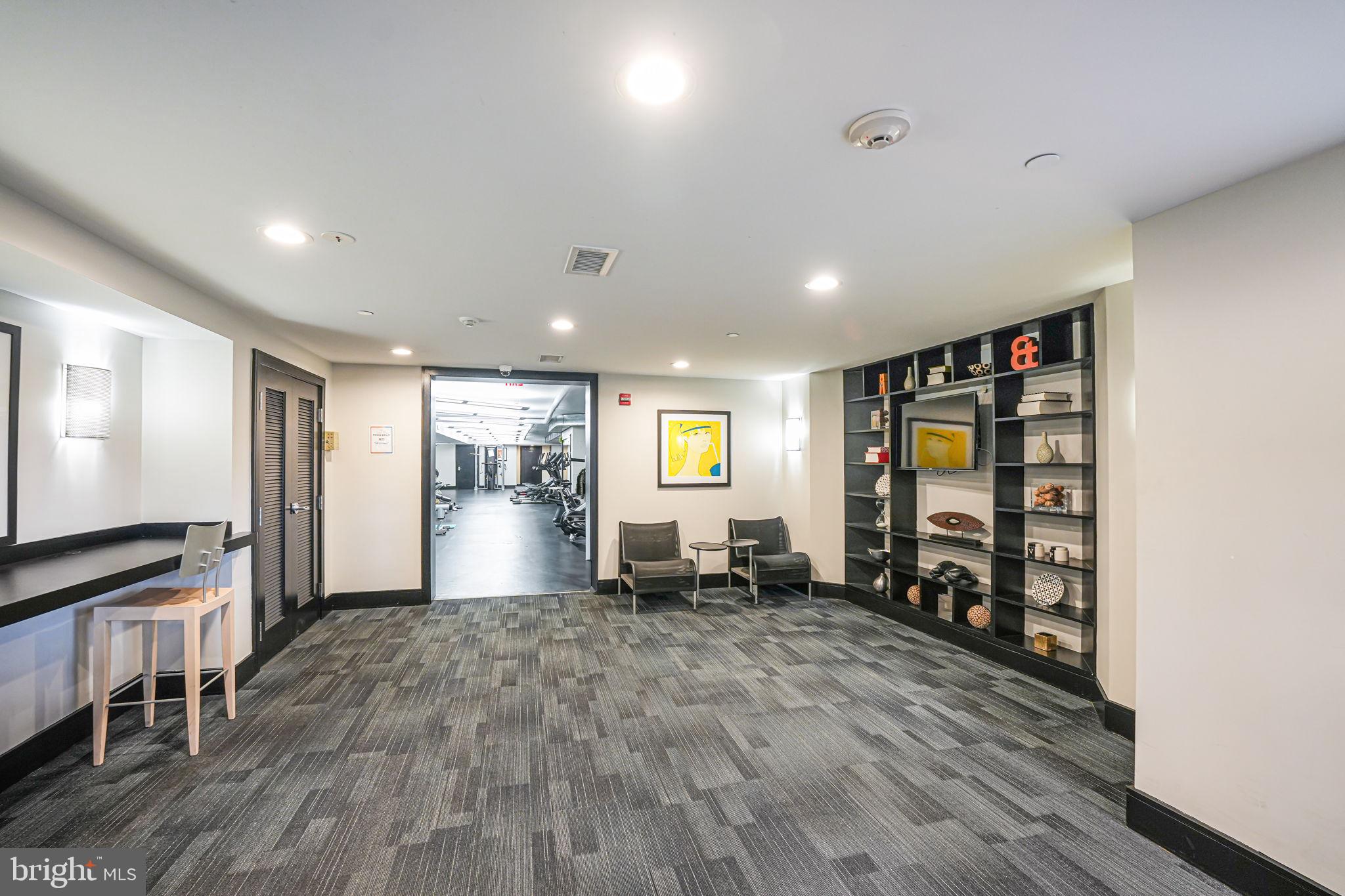 3611 38th Street Northwest, Unit 209 Washington, DC 20016 - Photo 23 of 30 an empty room with wooden floor closet and windows