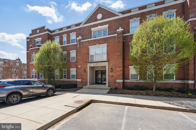a view of a car parked in front of a building