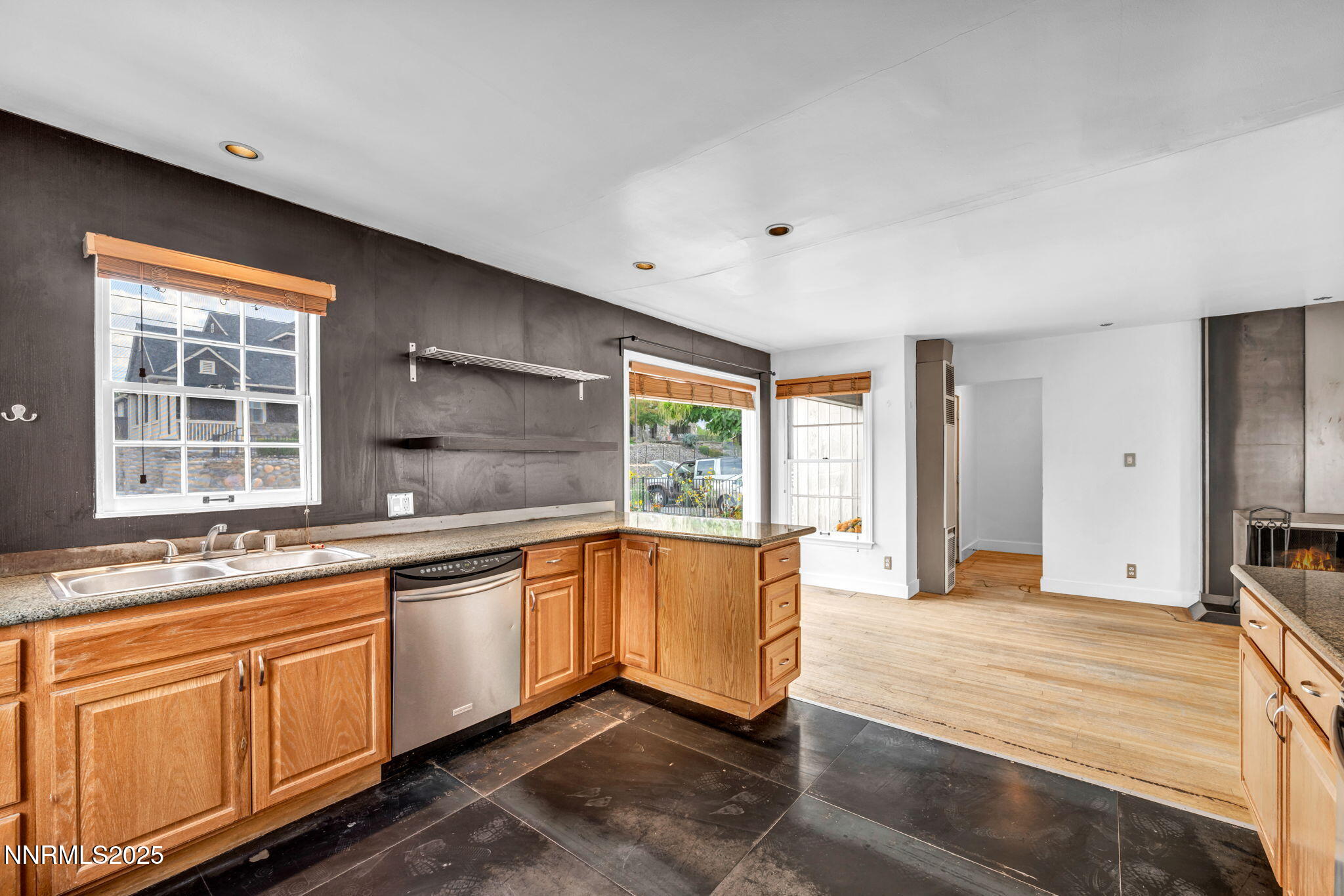 343-347 Mt Rose Street Reno, NV 89509 - Photo 19 of 46 a large white kitchen with granite countertop a large window and a sink