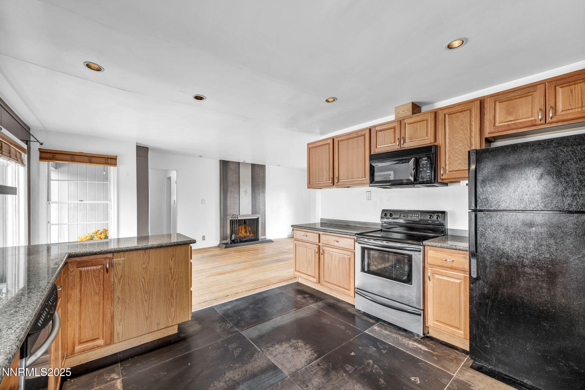 343-347 Mt Rose Street Reno, NV 89509 - Photo 20 of 46 a kitchen with stainless steel appliances granite countertop a stove a sink and a refrigerator