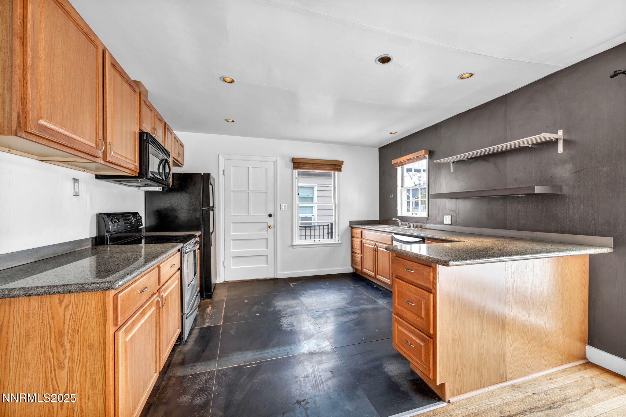 343-347 Mt Rose Street Reno, NV 89509 - Photo 24 of 46 a kitchen with stainless steel appliances granite countertop a stove a sink and a refrigerator
