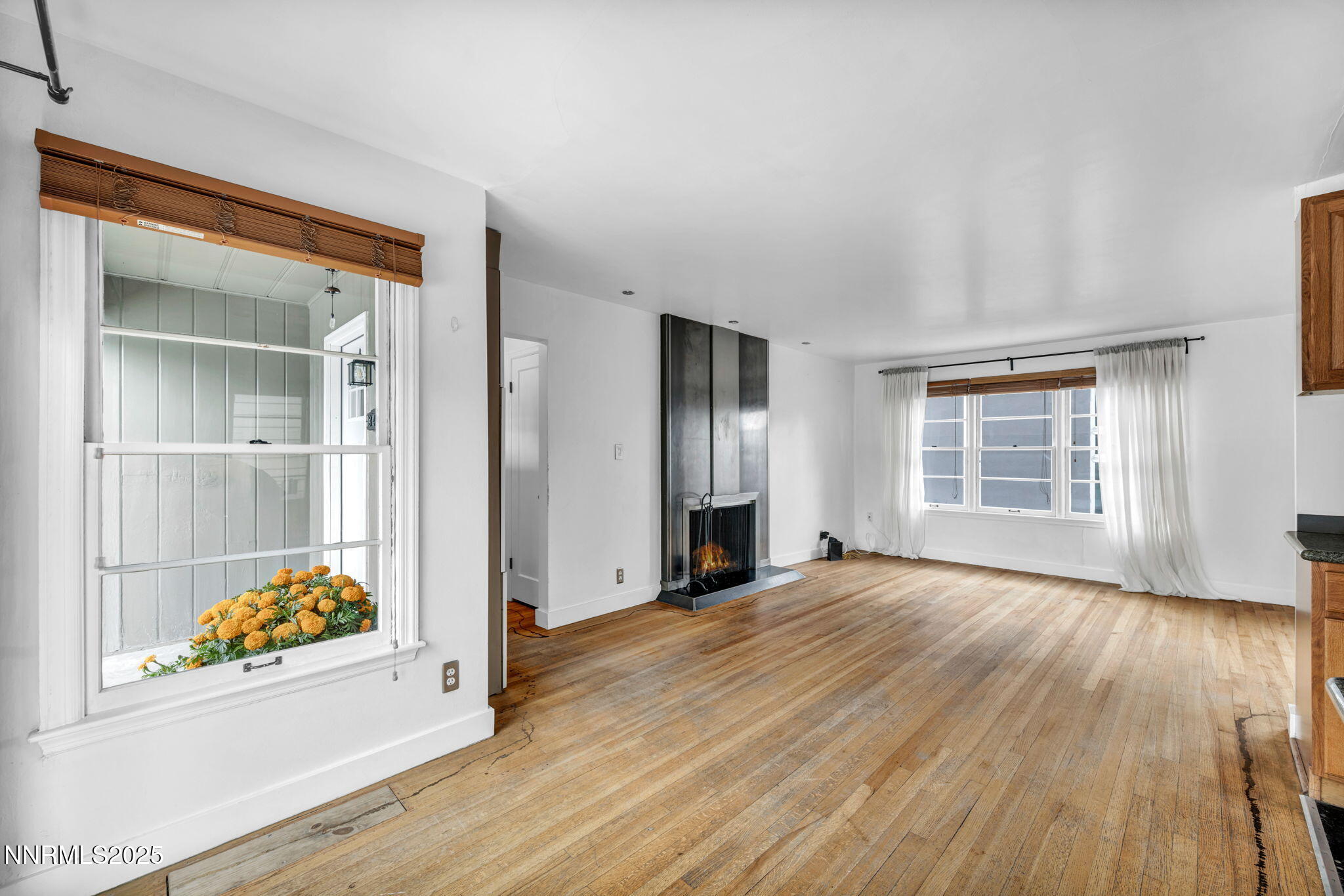 343-347 Mt Rose Street Reno, NV 89509 - Photo 25 of 46 an empty room with wooden floor cabinet and windows