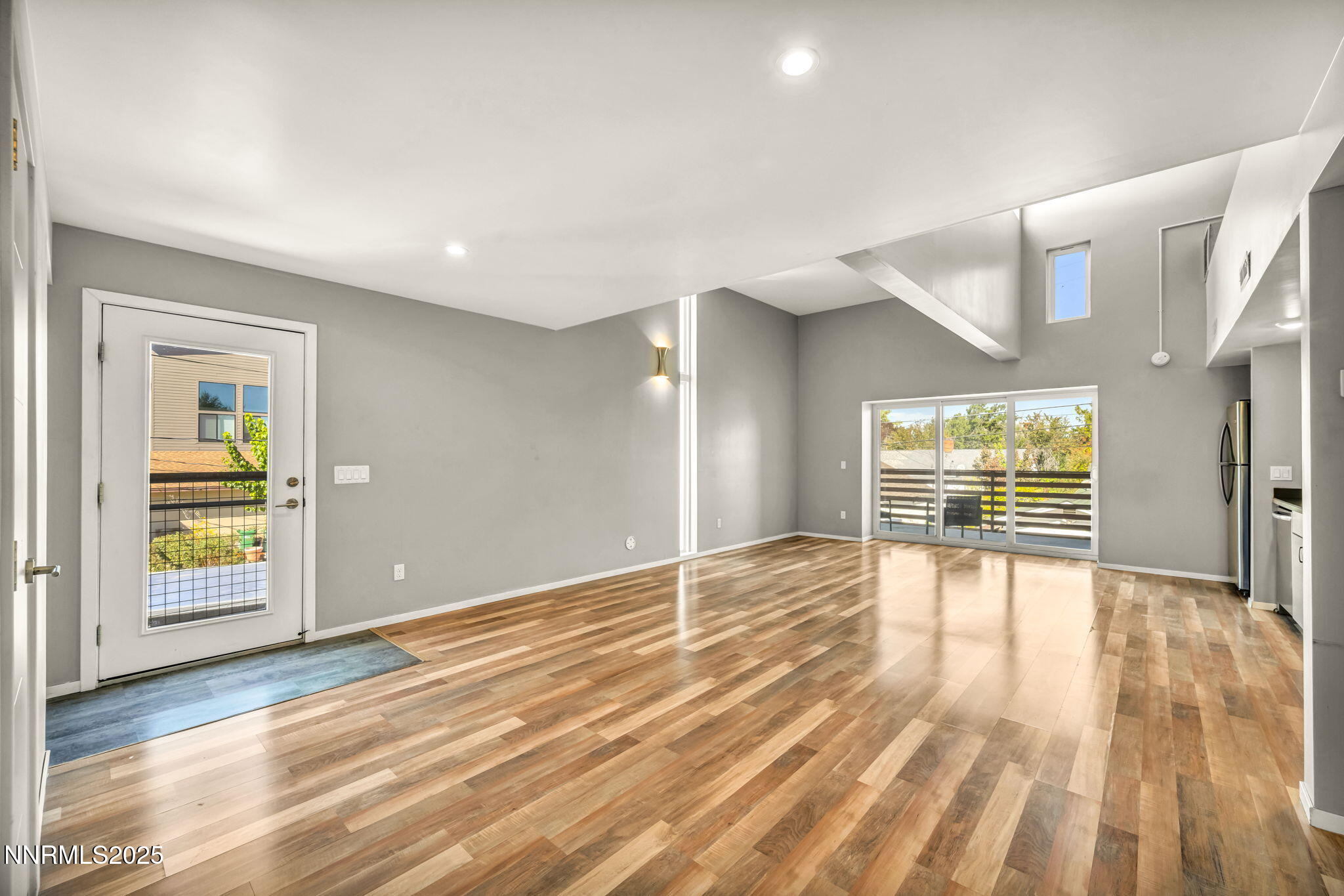 343-347 Mt Rose Street Reno, NV 89509 - Photo 42 of 46 a view of empty room with wooden floor and fan