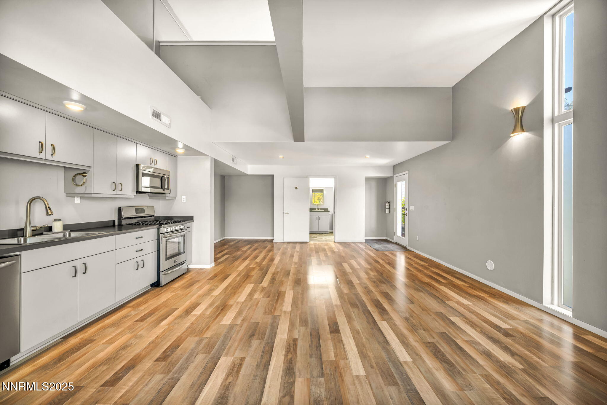 343-347 Mt Rose Street Reno, NV 89509 - Photo 43 of 46 a large kitchen with kitchen island granite countertop a sink window and stainless steel appliances