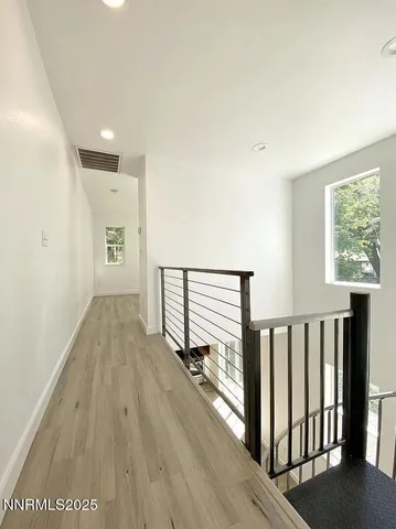 a view of entryway with wooden floor