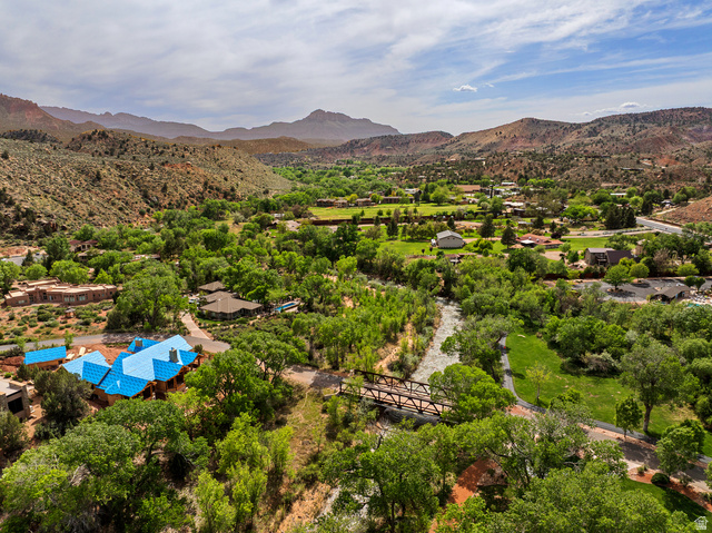 105 River Bend Circle, Unit 105 Springdale, UT 84767 - Photo 56 of 56 Expansive aerial view showcasing a natural landscape with mountainous terrain and abundant greenery