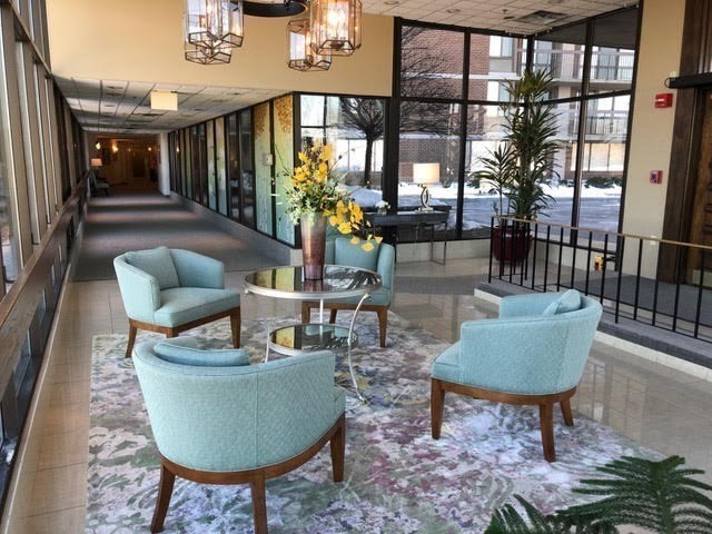 40 Village Road, Unit 309 Middleton, MA 01949 - Photo 13 of 22 a living room with furniture and a floor to ceiling window