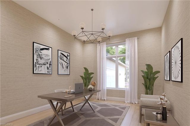 a living room with furniture a chandelier and a window