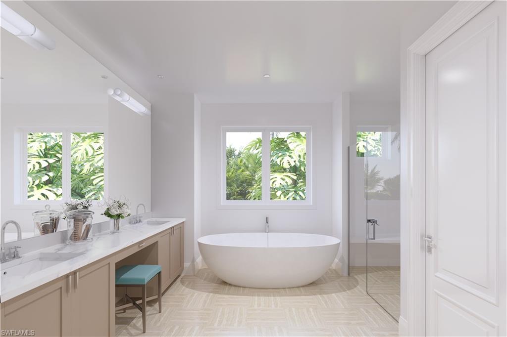 16745 Cabreo Drive Naples, FL 34110 - Photo 6 of 29 a spacious bathroom with a granite countertop sink and a bathtub